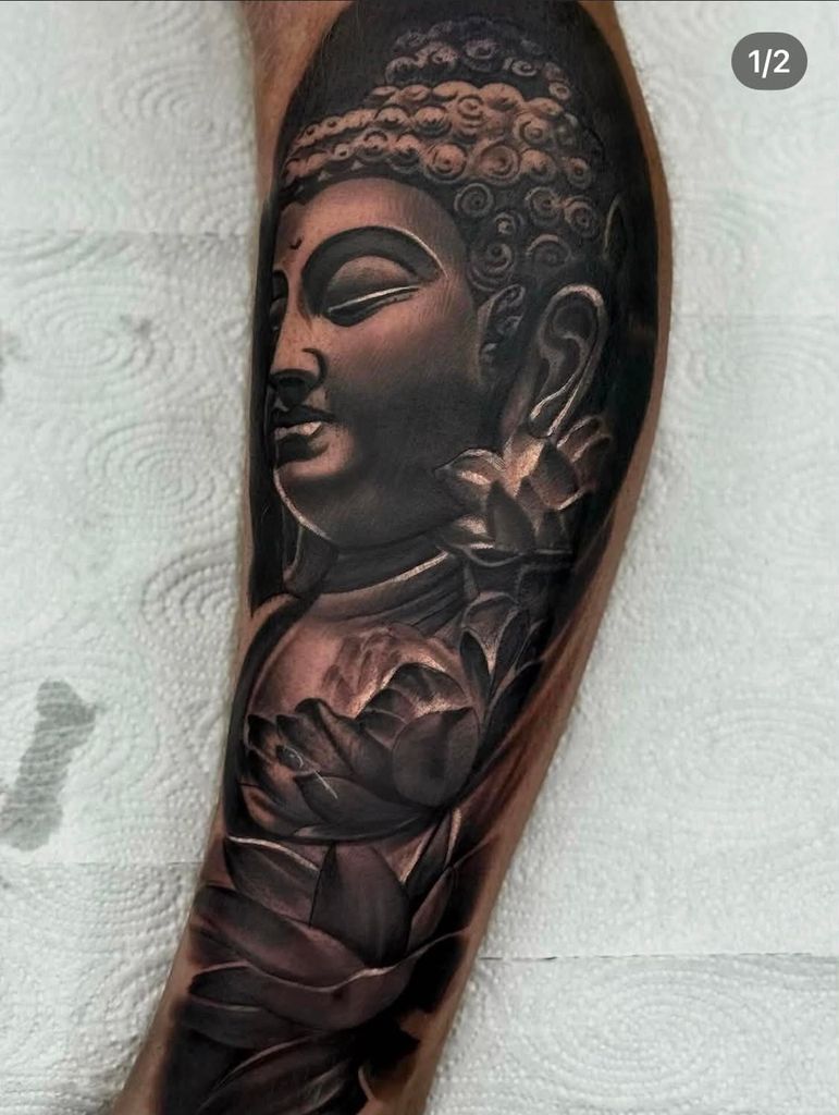 Black and Grey Buddha with Lotus Flowers Arm Tattoo